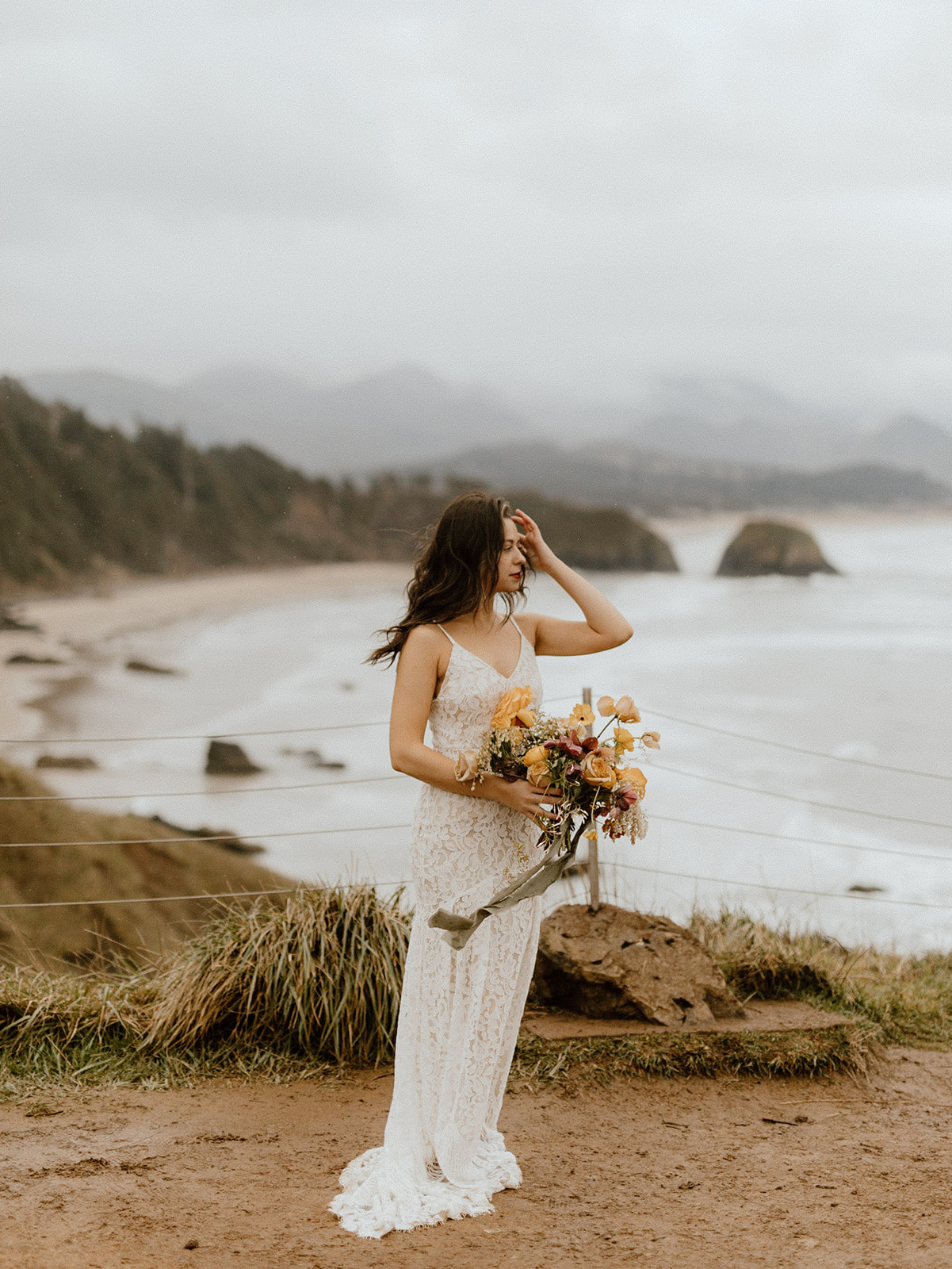 Image of bride with bouquet on the Oregon coast at Oswald State Park.