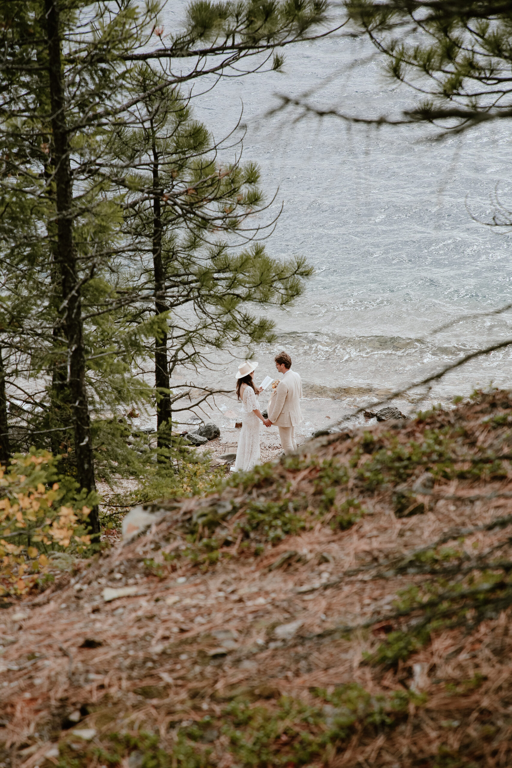 Image of a couple eloping at Lake McDonald in Glacier National Park.